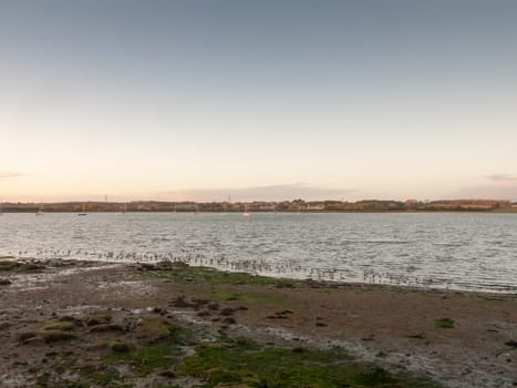 beautiful sunset evening bay scene open space water surface waves beach; essex; england; uk