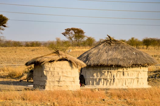 Traditional massai hut made of earth and wood in a rural village of Tanzania