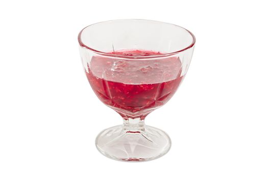 Raspberry jam in the glass dessert stem bowl on a light background
