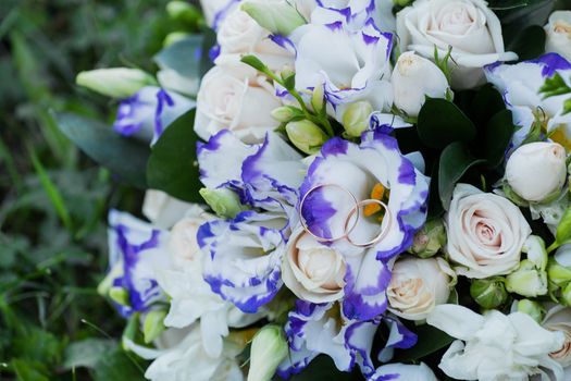 Beautiful wedding bouquet and rings.