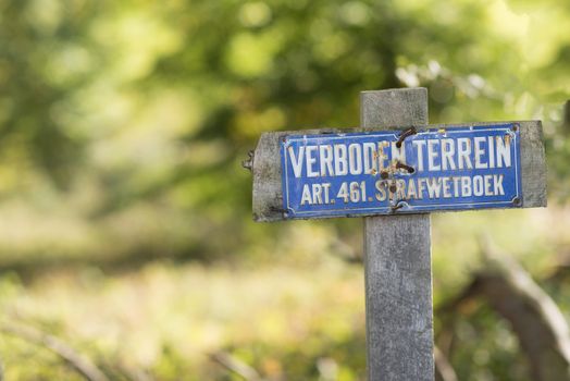 Blue sign with the Dutch text no access article 461 criminal law code
