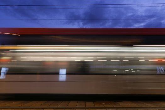 Side view blurred motion metro on a platform