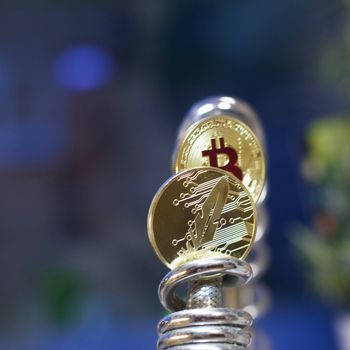 Digital currency physical metal bitcoin coin. Cryptocurrency cash concept.