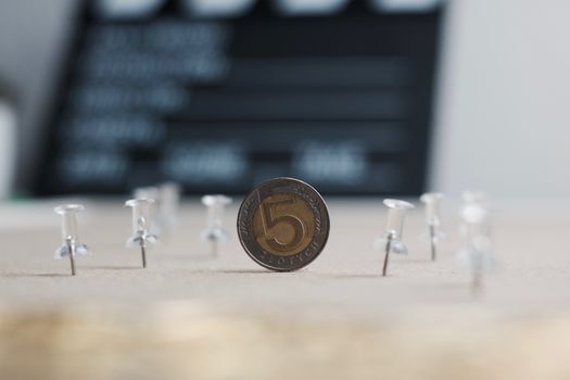 Physical polish coin near cinema board. Polish money lifestyle concept.