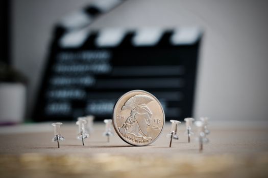Digital currency physical metal bitcoin coin. Cryptocurrency cinema concept.