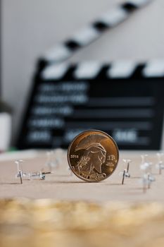 Digital currency physical metal bitcoin coin. Cryptocurrency cinema concept.