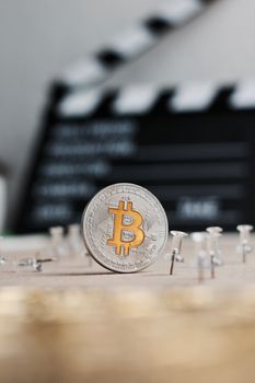 Digital currency physical metal bitcoin coin. Cryptocurrency cinema concept.
