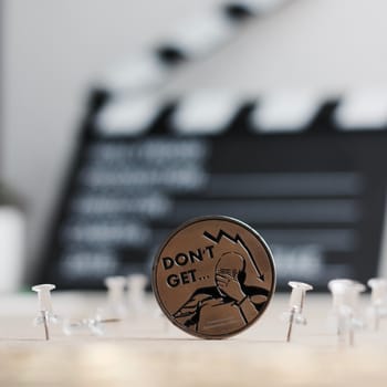 Digital currency physical metal bitcoin coin. Cryptocurrency cinema concept.