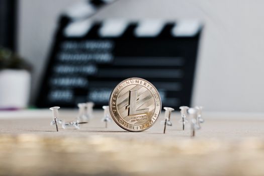 Digital currency physical metal litecoin coin. Cryptocurrency video concept.