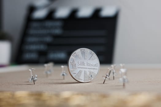 Digital currency physical metal bitcoin coin. Cryptocurrency cinema concept.