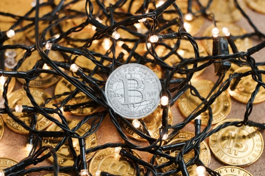 Digital currency physical metal bitcoin coin on the christmas concept.
