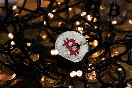 Digital currency physical metal bitcoin coin on the christmas concept.