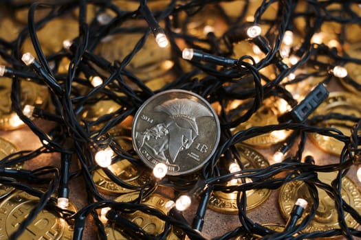 Digital currency physical metal bitcoin coin on the christmas concept.