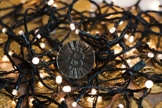 Digital currency physical metal bitcoin coin on the christmas concept.