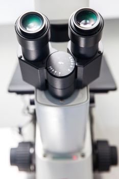 Close up of stereo microscope eyepieces in the laboratory