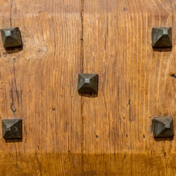 Close up of rustic old door in Spoleto, Italy.