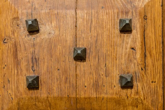 Close up of rustic old door in Spoleto, Italy.