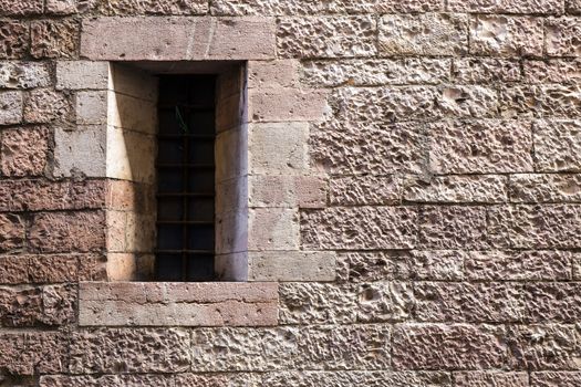 Assisi (Italy): Window on medieval stone wall