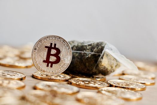 Digital currency physical bitcoin coin. Gold background coins concept.
