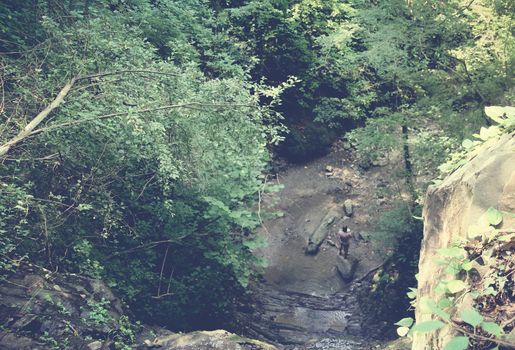 Man in the gorge of a mountain river.