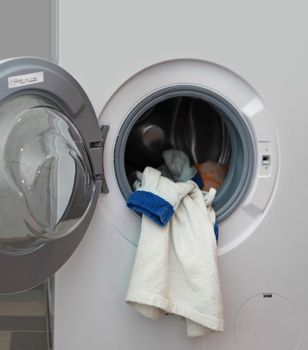 white dressing gown in the washing machine