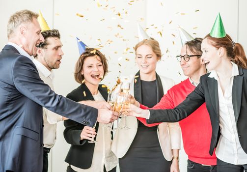 Business people celebrating New Year at office party