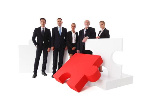 Business team portrait and big puzzle isolated on white background