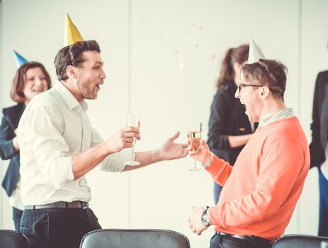 Business people celebrating New Year at office party