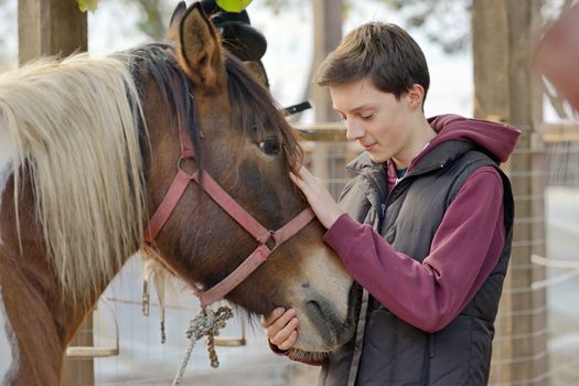 Affection of an teenager loving a horse