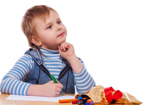 Little Girl drawing picture at table isolated on white