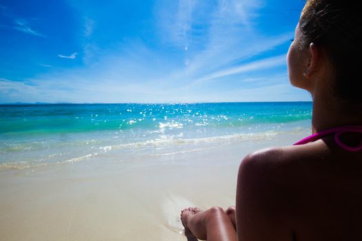 Young beautiful sexy woman relaxing on the beach