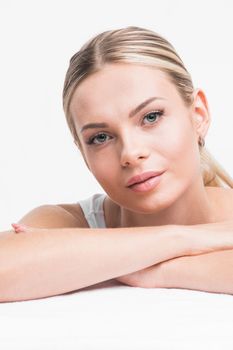 Portrait of young woman with perfect skin isolated on white background