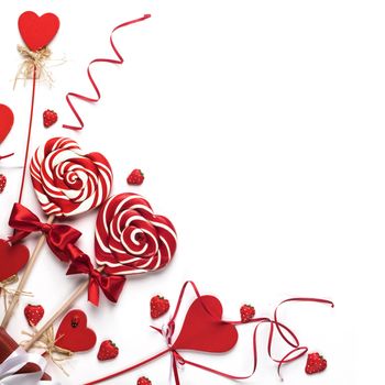 Valentines day decoration and heart shaped lollipops isolated on white background