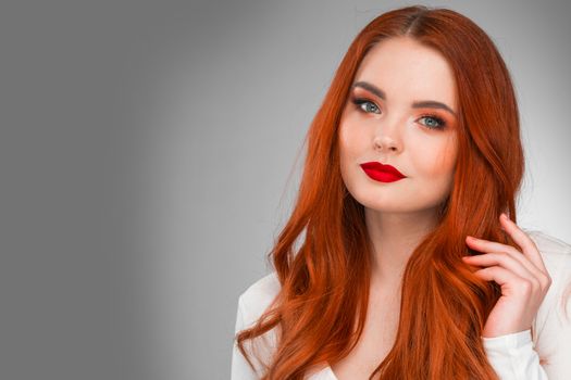 Photoshot of gorgeous redhead girl with bright makeup