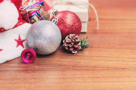 decorations and gift boxes on wooden board.