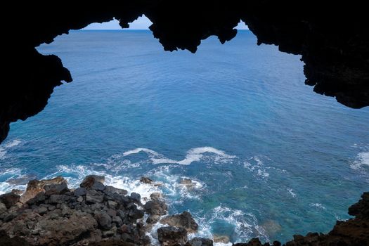 Cliffs and pacific ocean landscape vue from Ana Kakenga cave in Easter island, Chile