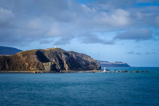 Lighthouse on cliffs near Wellington city, New Zealand