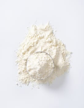 bowl of wheat flour on white background