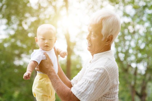 Grandfather with baby grandson, Asian family, life insurance concept.