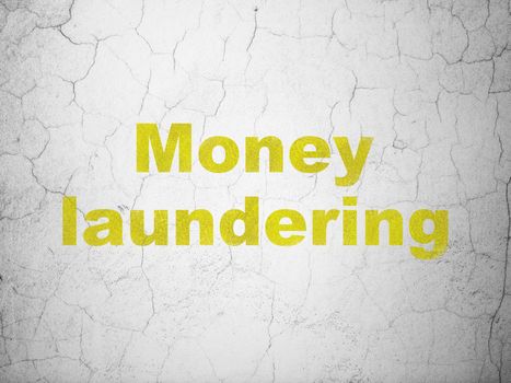 Currency concept: Yellow Money Laundering on textured concrete wall background