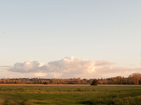 beautiful autumn sky sunset clouds over field in country landscape; essex; england; uk