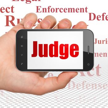 Law concept: Hand Holding Smartphone with  red text Judge on display,  Tag Cloud background, 3D rendering