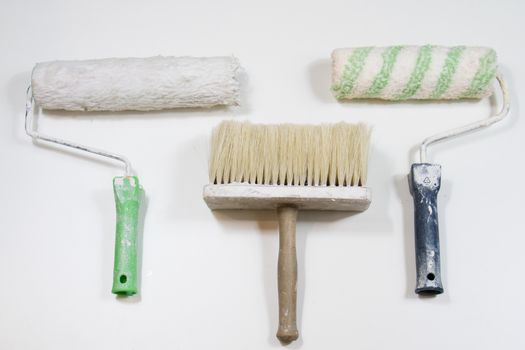 Roller and paint brush on a white background. Old painting tools