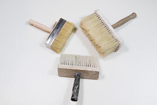 Roller and paint brush on a white background. Old painting tools