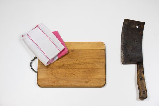 Old chopper and board, tools for butcher, white background.