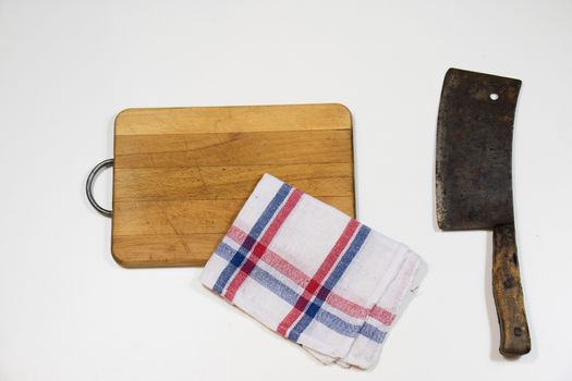 Old chopper and board, tools for butcher, white background.