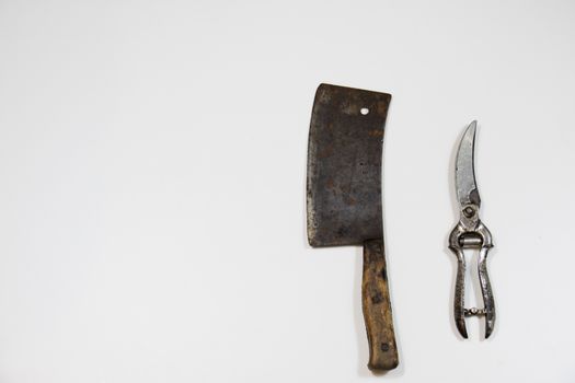 Old chopper and board, tools for butcher, white background.