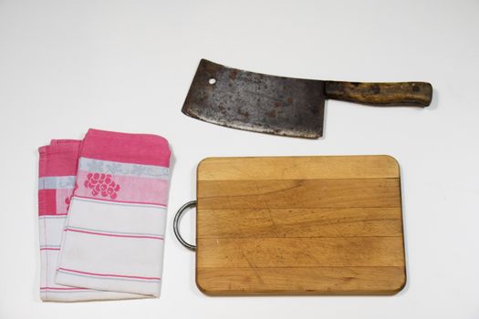 Old chopper and board, tools for butcher, white background.