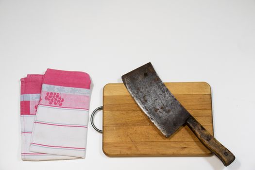 Old chopper and board, tools for butcher, white background.