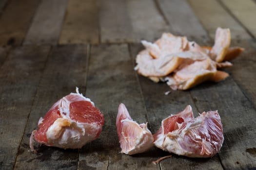 Picked grapefruit on a wooden table, juices and peaches, old kitchen